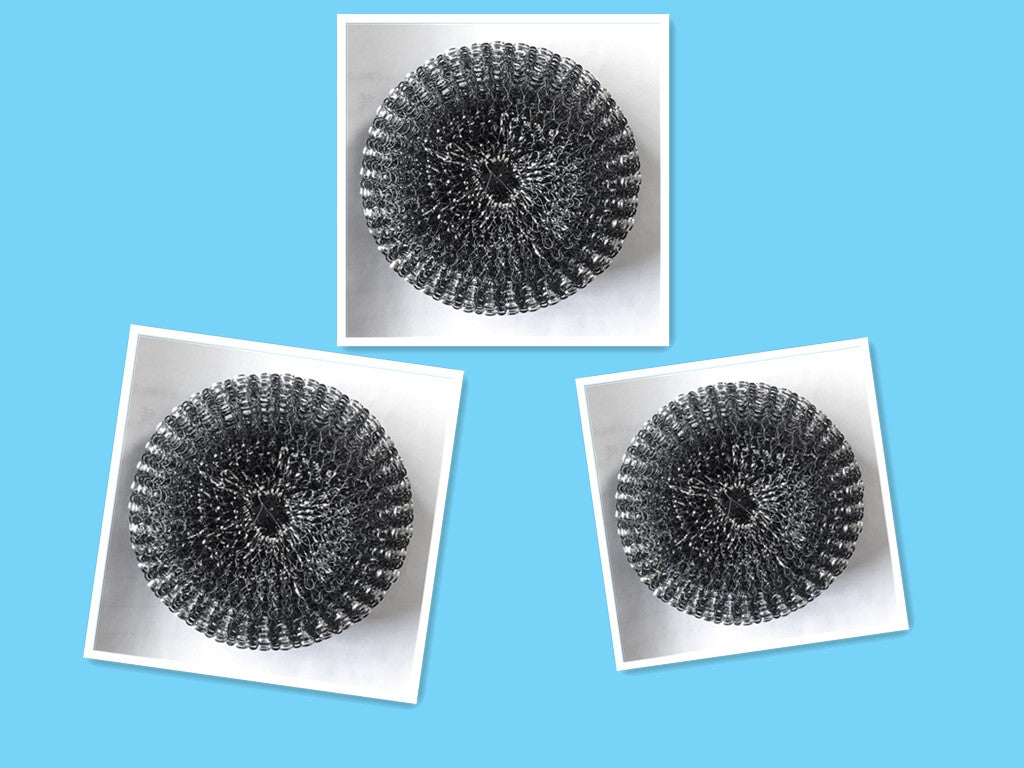 Soap dispensing brush scrubbing a dish